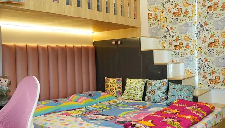 Creative kids’ bedroom designed by interior designers in Vijayanagar Bangalore featuring colorful decor, loft bed, and playful patterns by Grandeur Elite