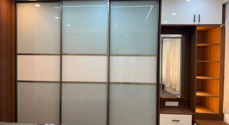 Modern sliding wardrobe design by home interior design in JP Nagar Bangalore.