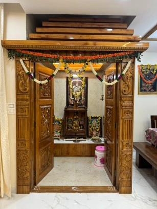 Luxury pooja room by Home Interior Designers in Rajarajeshwari Nagar