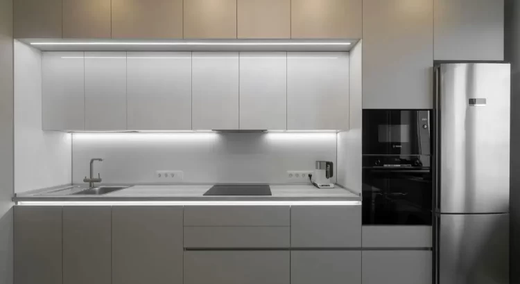 Modern Modular Kitchen Interior Design in RR Nagar with minimalist grey cabinets and LED lighting.