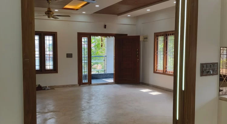 Home interior with woodwork and layered lighting by Home Interior Designers in RR Nagar